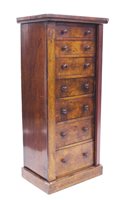 Lot 1299 - Victorian walnut Wellington chest with seven...