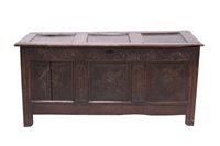 Lot 1306 - 17th century carved oak coffer with triple...