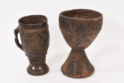 Lot 874 - Two old African Kuba carved wooden goblets 18-20cm