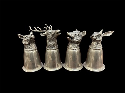 Lot 941 - Set of four Italian Gucci silver plated stirrup cups with Stag, Fox, Boar and Hare mounts