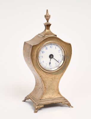 Lot 304 - Edwardian silver cased mantel clock of shield form