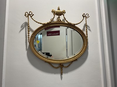 Lot 5372 - Adams style oval gilt gesso wall mirror