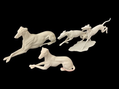 Lot 128 - Vienna model of a hound, and another dog model and a group of two running dogs