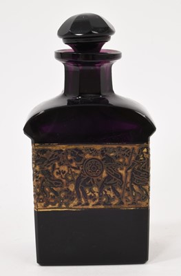 Lot 104 - Amethyst tinted glass scent bottle and stopper