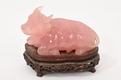 Lot 866 - Chinese rose quartz carving of a buffalo, wood stand