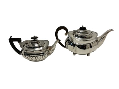 Lot 283 - Late Victorian silver tea pot of half fluted form, with gadrooned border, hinged cover