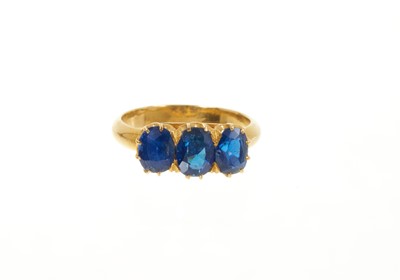 Lot 414 - Edwardian gold sapphire three stone ring