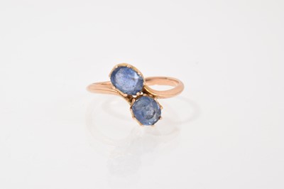 Lot 415 - Edwardian gold sapphire two stone cross-over ring