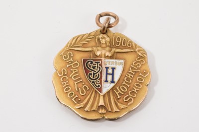 Lot 421 - Edwardian gold shot put medallion for St. Paul's School versus Hotchkiss School, with enamel decoration and engraved presentation inscription to reverse, dated 1906. 33mm diameter