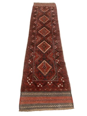 Lot 5366 - Eastern runner with central medallions on red and blue ground, 250cm x 51cm