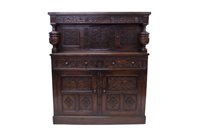 Lot 1343 - 17th century-style carved oak court cupboard,...