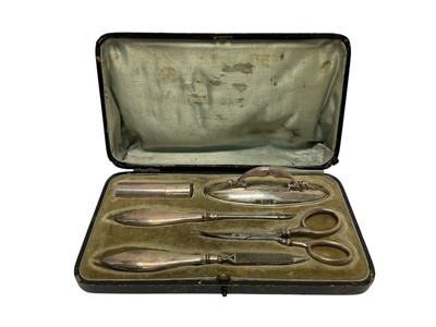 Lot 293 - Early 20th century silver mounted manicure set