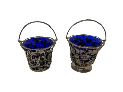 Lot 321 - Near pair of George III style silver cream pails / sugar baskets by William Comyns
