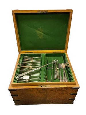 Lot 301 - Late 19th century iron and brass bound, Oak travelling canteen, with a fitted interior and five, green beize lined lift out trays, fitted for cutlery and containing a selection of silver plated...