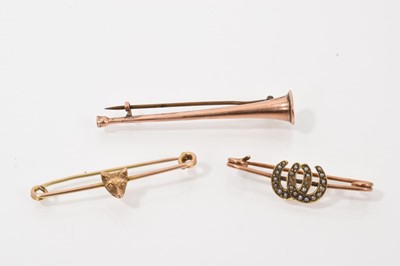 Lot 458 - Three Edwardian gold sporting brooches