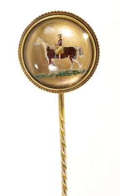 Lot 523 - Victorian Essex Crystal stick pin depicting a jockey on a racehorse, in gold mount