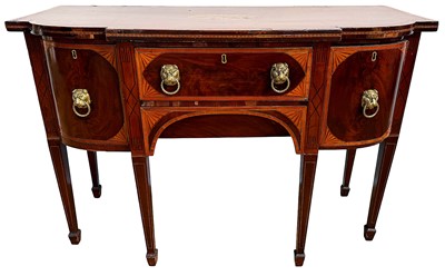Lot 1401 - George III mahogany and inlaid bowfront sideboard, the shaped top centred by inlaid patera, over two central drawers flanked by cupboard and cellarette drawer on square tapered legs and spade fe...