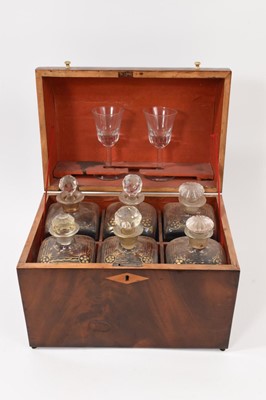 Lot 871 - Georgian six decanter tantalus, domed top with two glasses, with key