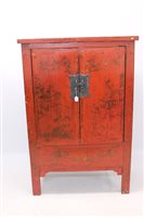 Lot 1363 - Chinese red lacquered cupboard with gilt...