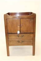 Lot 1365 - George III mahogany bedside cupboard with...