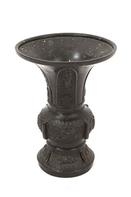 Lot 696 - Chinese bronze Hu vase, decorated with mythical beasts in clouds, 18.5cm high