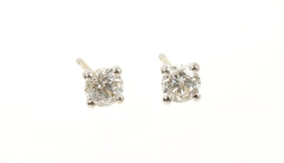 Lot 540 - Pair of diamond singles stone stud earrings with I.G.I reports