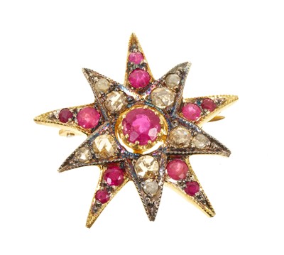 Lot 546 - Victorian style diamond and ruby star pendant / brooch