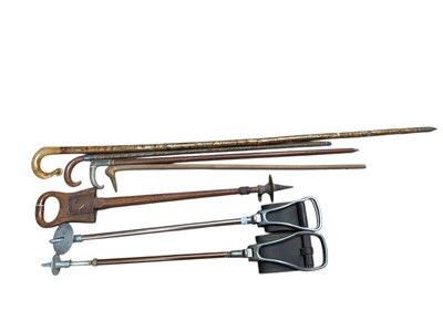 Lot 931 - Three vintage shooting sticks to include an unusual wooden example, silver mounted and horn handled stick and others (7)