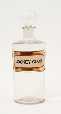 Lot 904 - Antique glass apothecary bottle and stopper with inset 'Jockey Club' label, 22cm high