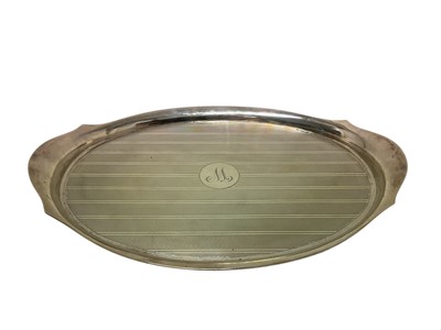 Lot 347 - George V silver dressing table tray of oval form, with engine turned decoration and engraved initial 'M' to central cartouche, (Birmingham, 1925), maker Hasset & Harper Ltd, 32.