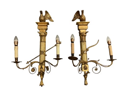 Lot 1463 - Impressive pair of Classical Revival gilt gesso twin brass wall lights, with ho-ho bird surmount raised on classical column, issuing twin scrolling candle arms, 19th century or earlier, 82...