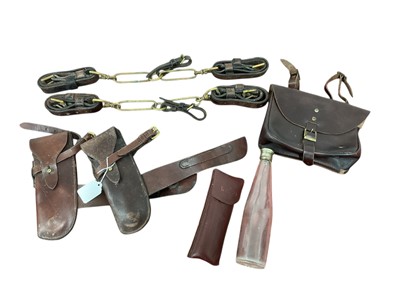 Lot 910 - Two pairs of leather cased wire cutters, glass flask with plated top, two sets of leather and brass hound coupling collars and other items