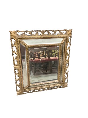 Lot 1472 - 19th century Florentine style peripheral plate wall mirror, with bevelled plates in pierced scroll frame, 91 x 79cm
