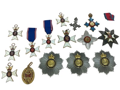 Lot 108 - Collection of fifteen replica / copy medals and decorations to include, M.V.O. (x6), K.B.E. Star (x1), M.B.E. (x1), C.B.E. (x1), Knight Bachelor's Badge (x1), G.C.V.O. (x1), L.V.O., (x1) and K.C...