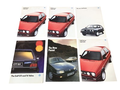 Lot 47 - Three boxes of Volkswagen related items to include a black and white photograph of a VW Beetle Grass track racing and other items (2 boxes).