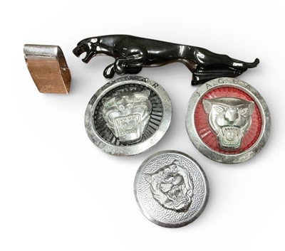 Lot 19 - Jaguar black painted large type leaping cat mascot, Jaguar bonnet badge and two-wheel centres (4).