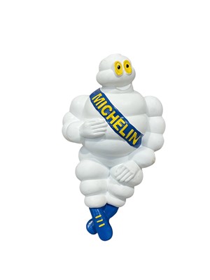 Lot 154 - Bibendum (The Michelin Man), lorry style figure, approximately 42cm in length.