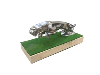 Lot 115 - Modern Jaguar leaper mascot mounted on a marble plinth base, approximately 20cm in overall length.