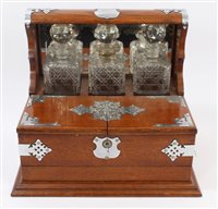 Lot 814 - Edwardian oak framed tantalus / cigar / gaming...