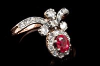 Lot 535 - Unusual ruby and diamond cluster ring with an...