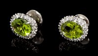 Lot 530 - Pair peridot and diamond oval cluster earrings,...