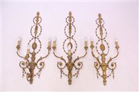 Lot 1422 - Set of three rococo-style wall appliqués, each...