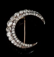 Lot 451 - Victorian diamond crescent brooch, set with a...