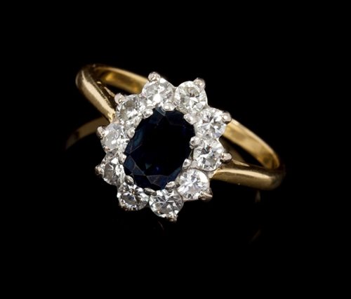 Lot 456 - Sapphire and diamond cluster ring, the oval
