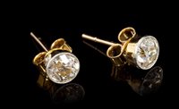 Lot 457 - Pair diamond single stone earrings, each with...