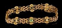 Lot 473 - Edwardian rose gold gate bracelet, the...