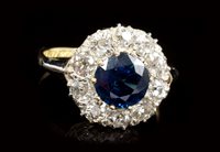 Lot 500 - Sapphire and diamond cluster ring, the round...