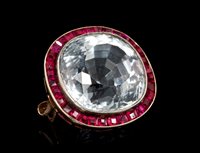 Lot 509 - Ruby and topaz brooch, the cushion cut natural...