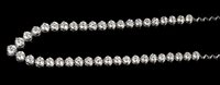 Lot 512 - Diamond rivière necklace composed of a line of...