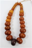 Lot 523 - Old amber bead necklace with a string of...